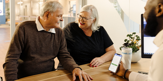 Daughter hugging mother in kitchen
