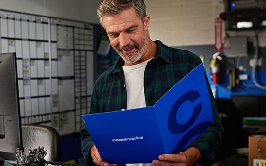 Member seeing the Coast Capital folder in his hands