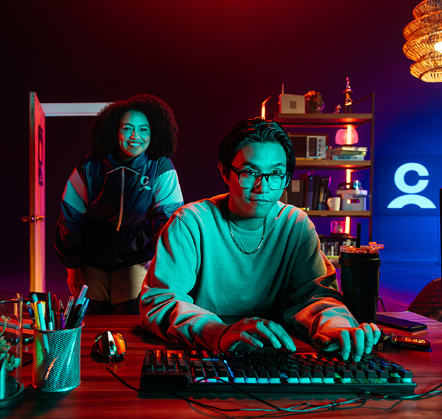 Person seated with a laptop in a modern setting, illustrating online learning opportunities to start, switch, or advance a career through Coursera partnership.